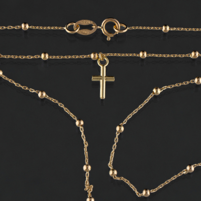 Cadena en oro amarillo de 18 kt a modo de rosario con colgante en forma de cruz latina.