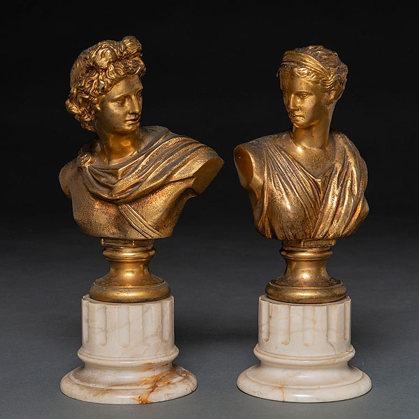 "Apolo y Dafne" Conjunto de dos bustos de estilo clásico en bronce dorado. Siglo XIX-XX