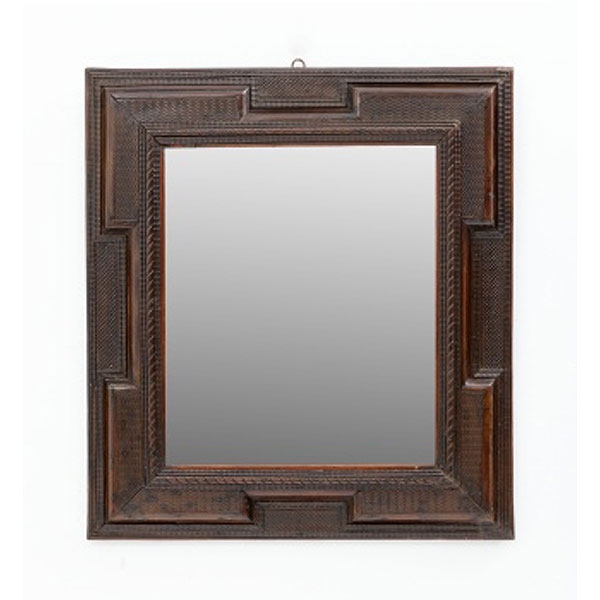 Espejo holandés en madera de ébano tallada con decoración geométrica y luna original.  Época: S. XVIII Medidas: 88 x 77,5 cm.