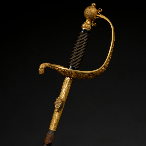 Espada con empuñadura en bronce dorado h. 1900