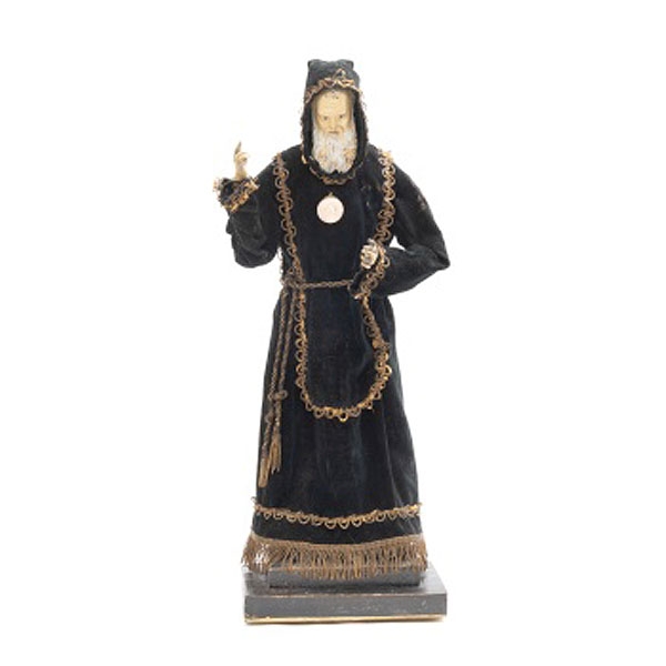 Talla de vestir con cabeza y manos en madera tallada y policromada representando San Francisco de Paula con hábito en terciopelo y pasamanería. 