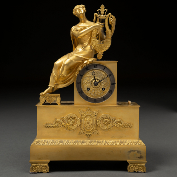 "Alegoría de la música" Reloj de sobremesa época restauración en bronce dorado del siglo XIX