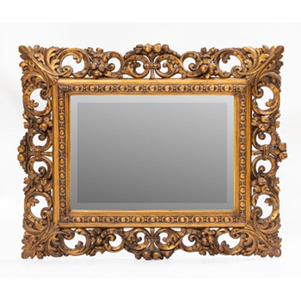 Espejo con marco en madera tallada y dorada con decoración geométrica, vegetal y rocallas. Luna biselada. Estilo Luis XVI.  Época: Pp. S. XX