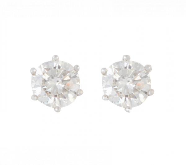 Pendientes dormilonas con brillantes de 1,36 y 1,26 ct respectivamente, engastados en seis garras.   En oro blanco de 18 K.