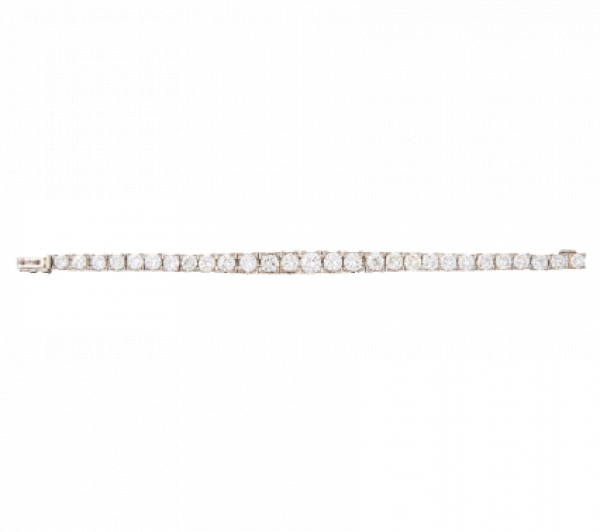 Pulsera de brillantes de tamaño creciente hacia el centro. En oro blanco de 18K.