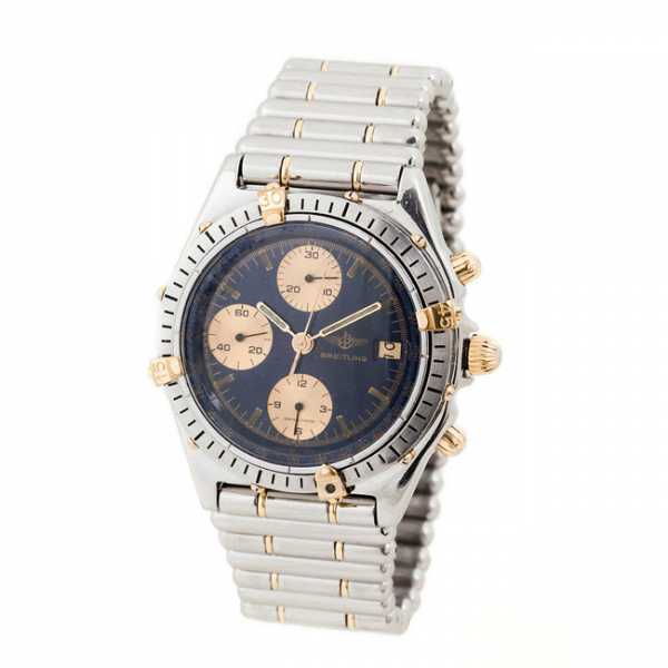 Reloj cronógrafo suizo BREITLING Chronomat, en caja 38 mm, ref. 81.950, nº 66440 con numerales de oro amarillo 18 K, y brazalete Rouleaux 