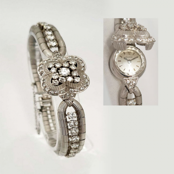 Reloj-joya, sra., suizo, OMEGA con brazalete en oro blanco, cuajados de limpios y blancos diamantes, talla brillante