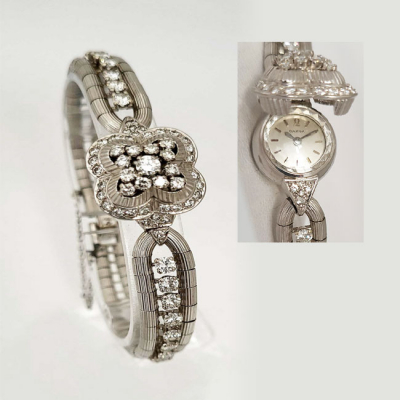 Reloj-joya, sra., suizo, OMEGA con brazalete en oro blanco, cuajados de limpios y blancos diamantes, talla brillante