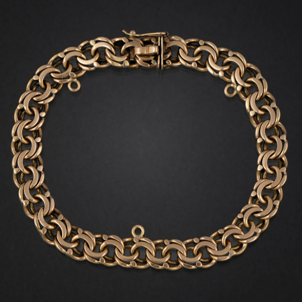 Pulsera de doble eslab&oacute;n barbado en oro amarillo de 18 kt.