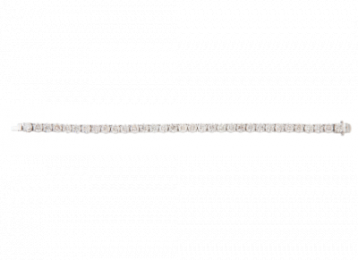 Pulsera rivière brillantes engastados en garras articuladas, de color estimado. En oro blanco de 18K.