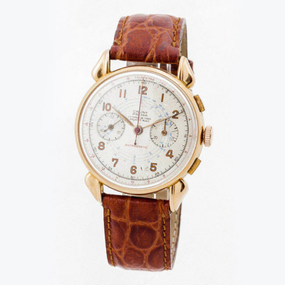 Reloj cronógrafo vintage, cab., suizo CAUNY PRIMA (La Chaux-de-Fonds), en caja original de oro rosa 18 K, 38 mm, con asas gallonadas.