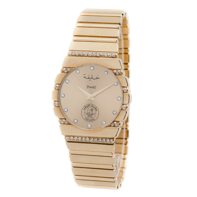 Reloj cab., suizo PIAGET Polo ref. 7561 C 735 , en caja, 33 mm, y brazalete articulado, originales, en oro amarillo 18 K, decorados con bandas de limpios y blancos diamantitos, talla brillante.