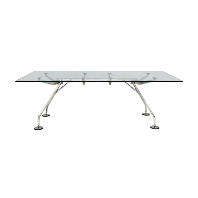 Norman Foster (Reddish, Reino Unido, 1935) para Tecno. Mesa modelo «NOMOS 220» con estructura esqueleto en metal y aluminio cromado. Sobre en cristal templado transparente apoyado directamente sobre ventosas acolchadas. Sellos de origen.