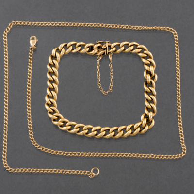 Conjunto de pulsera y cadena de eslabones en oro amarillo de 18 kt.