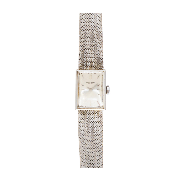 Reloj Universal Geneve de pulsera para señora. En oro blanco. Esfera argenté con numeración a trazos aplicados.