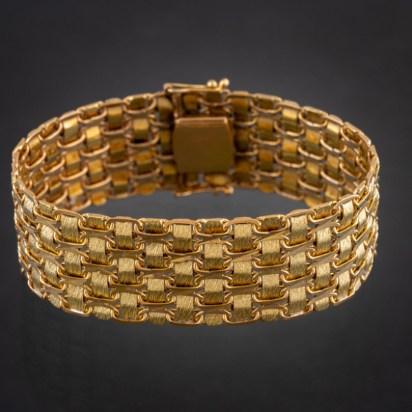 Pulsera de malla ancha en oro amarillo de 18kt de dos tonalidades.