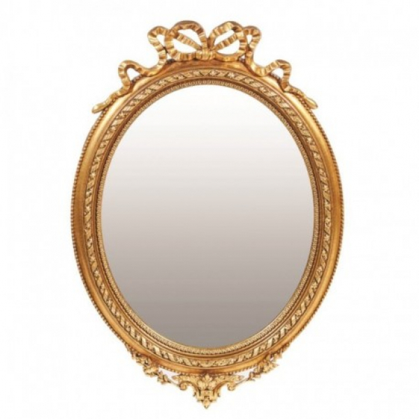 Espejo ovalado estilo Luis XVI en madera tallada y dorada, ppios. del s.XX.