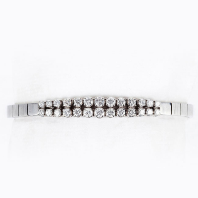Pulsera vintage en s&oacute;lida montura oro blanco 18 K y centro en doble fila riviere de limpios y blancos diamantes 