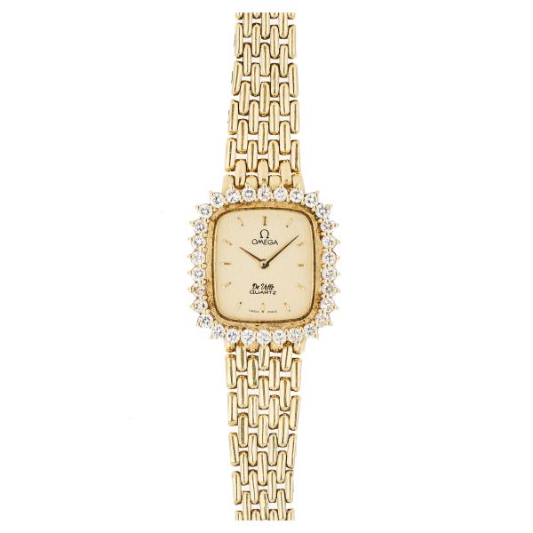Reloj Omega «De Ville» de pulsera para señora. En oro y bisel con diamantes talla brillante.