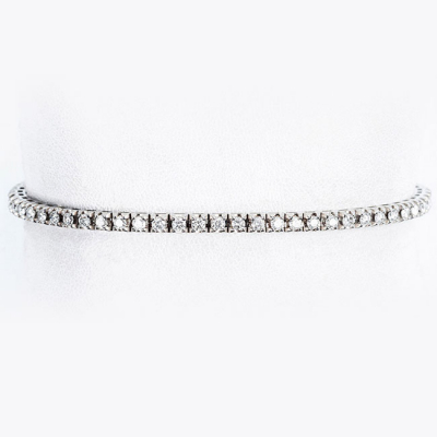 Pulsera rivière, en oro blanco con fila articulada de limpios y blancos diamantes, talla brillante