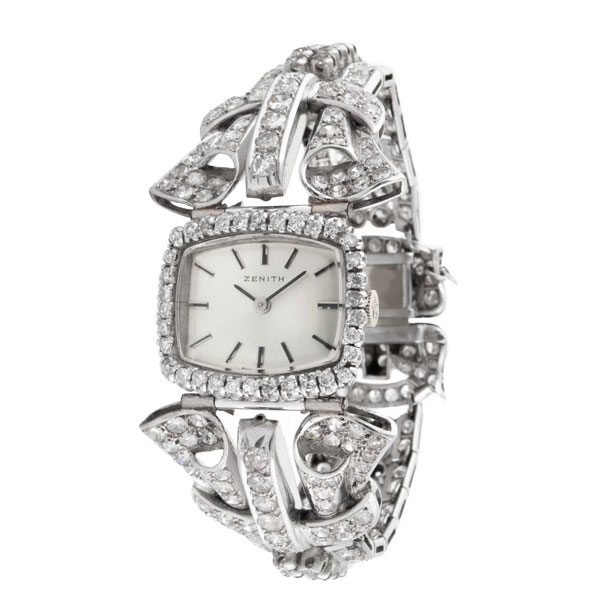 Reloj joya suizo ZENITH, en caja 25 x 20 mm y brazalete ancho de oro blanco 18 K cuajado de limpios y blancos diamantes, talla brillante antigua y diamantes 8/8