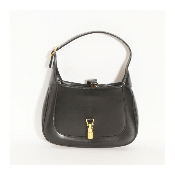 GUCCI. Bolso de mano modelo «Jackie 1961» en piel de tonalidad negra con herrajes en dorado y cierre de pistón.