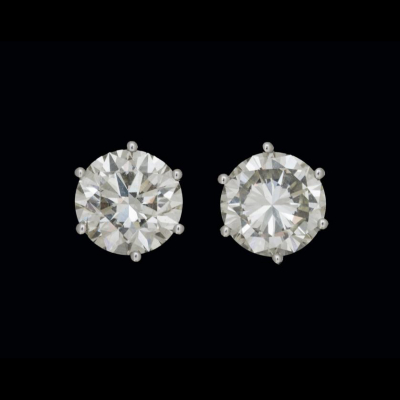  Pendientes de oro blanco de 18 K. dormilonas de brillantes de un peso total de 3 cts y 2,75 cts. 