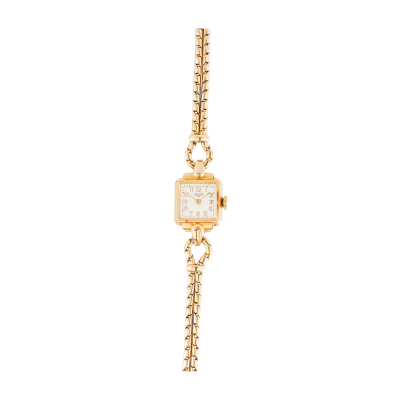 Reloj Longines de pulsera para señora, c.1930. En oro. Esfera en color marfil con numeración arábiga.