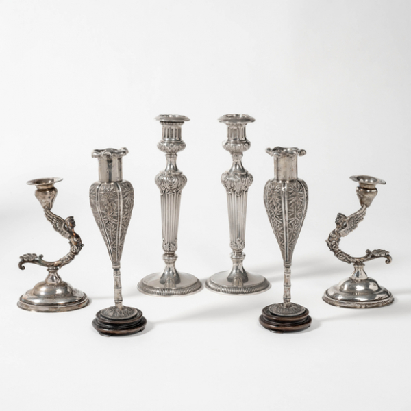 Conjunto de tres parejas de candeleros en plata española y punzonada del siglo XX.