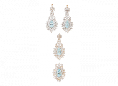Conjunto de pendientes, sortija y colgante de aguamarinas y brillantes con aguamarinas talla pera en grandes motivos con varias orlas y decoración de lazo superior.