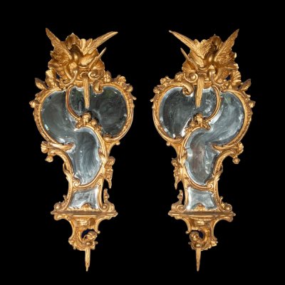 Pareja de espejos dorados en oro fino. Escuela Europea. Siglo XIX.