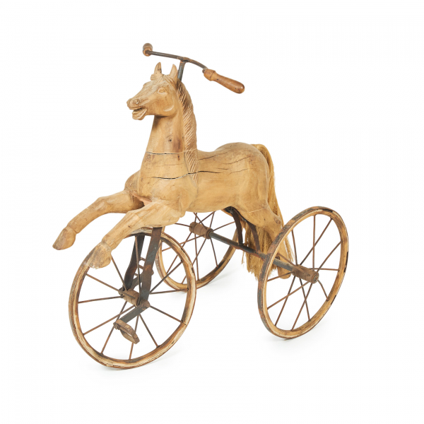 Triciclo en forma de caballo en madera tallada y hierro forjado, c.1900.