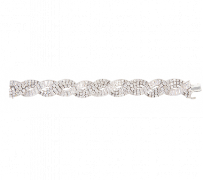 Elegante brazalete de brillantes años 50, compuesto por dos bandas entrelazadas de brillantes. En oro blanco de 18K.