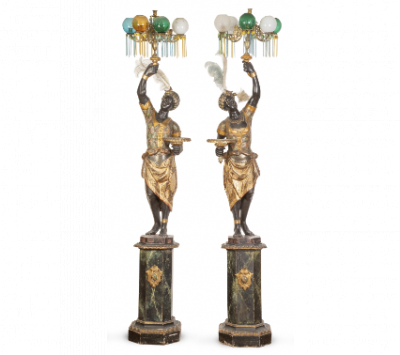 Pareja de "Blackamoors" en madera tallada, policromada y dorada.  Trabajo veneciano, pp. del S. XX. 