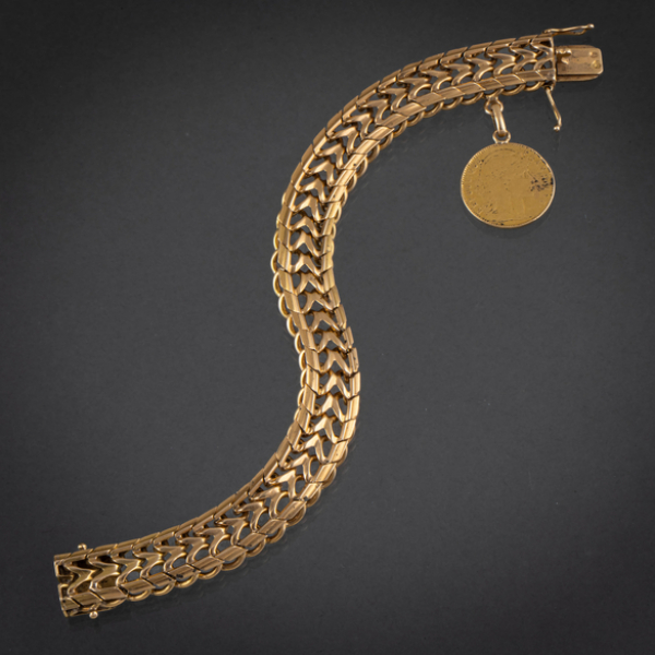 Pulsera ancha en oro amarillo de 18kt con moneda de 10 francos franceses como colgante.