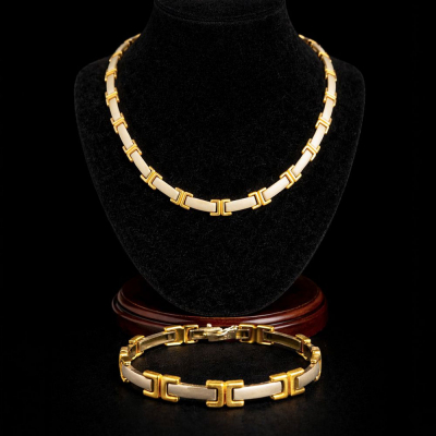 Exclusivo conjunto de Collar y Pulsera tipo CARTIER, en oro de 14k.