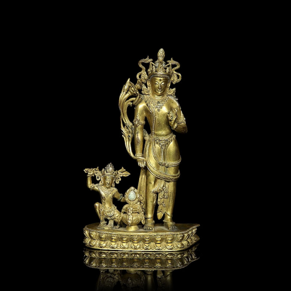 Excepcional grupo escultórico de bronce dorado "Vajrapani y Achala", Tibet, s. XIV.