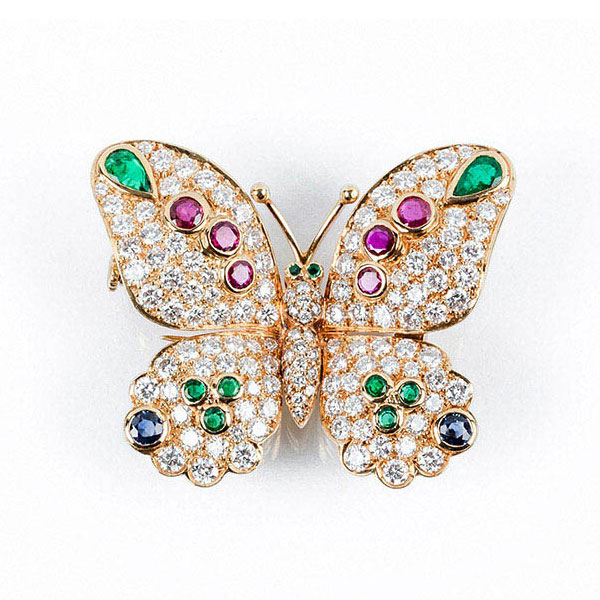 Alfiler de alta joyería en oro amarillo y diamantes, talla brillante, con rubíes, zafiros y esmeraldas