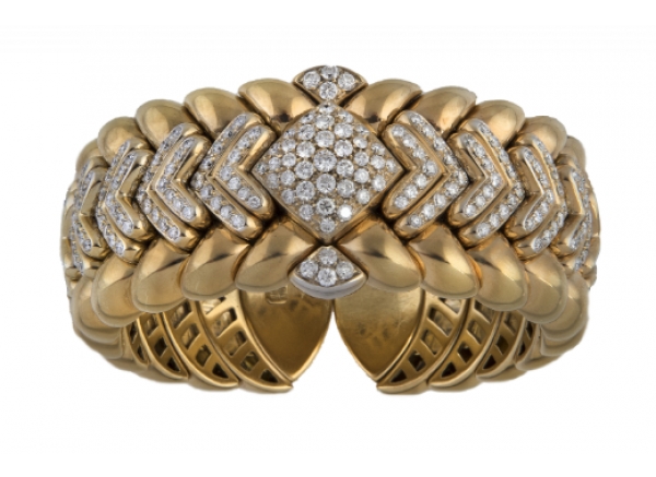 Brazalete ancho flexible de brillantes en montura gallonada de oro amarillo de 18K