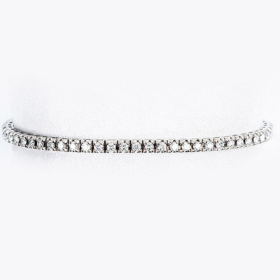 Pulsera rivière, en oro blanco 18 K, con fila articulada de limpios y blancos diamantes, talla brillante