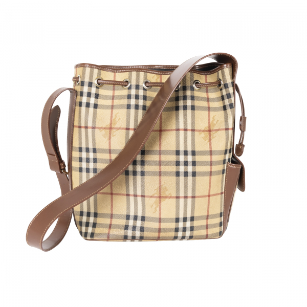 BURBERRY. Bolso tipo «bucket» con estampado Novacheck con cierre de cordón y asa en cuero marrón chocolate. En perfecto estado.